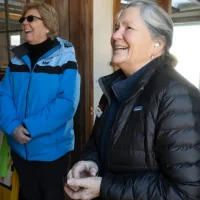 Visitors observing historic barn restoration work at Lampson Brook Farm in Belchertown Massachusetts