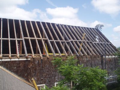 Roof with exposed wooden beams on old building being restored