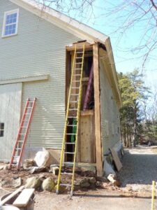 A house with a ladder in front of it.